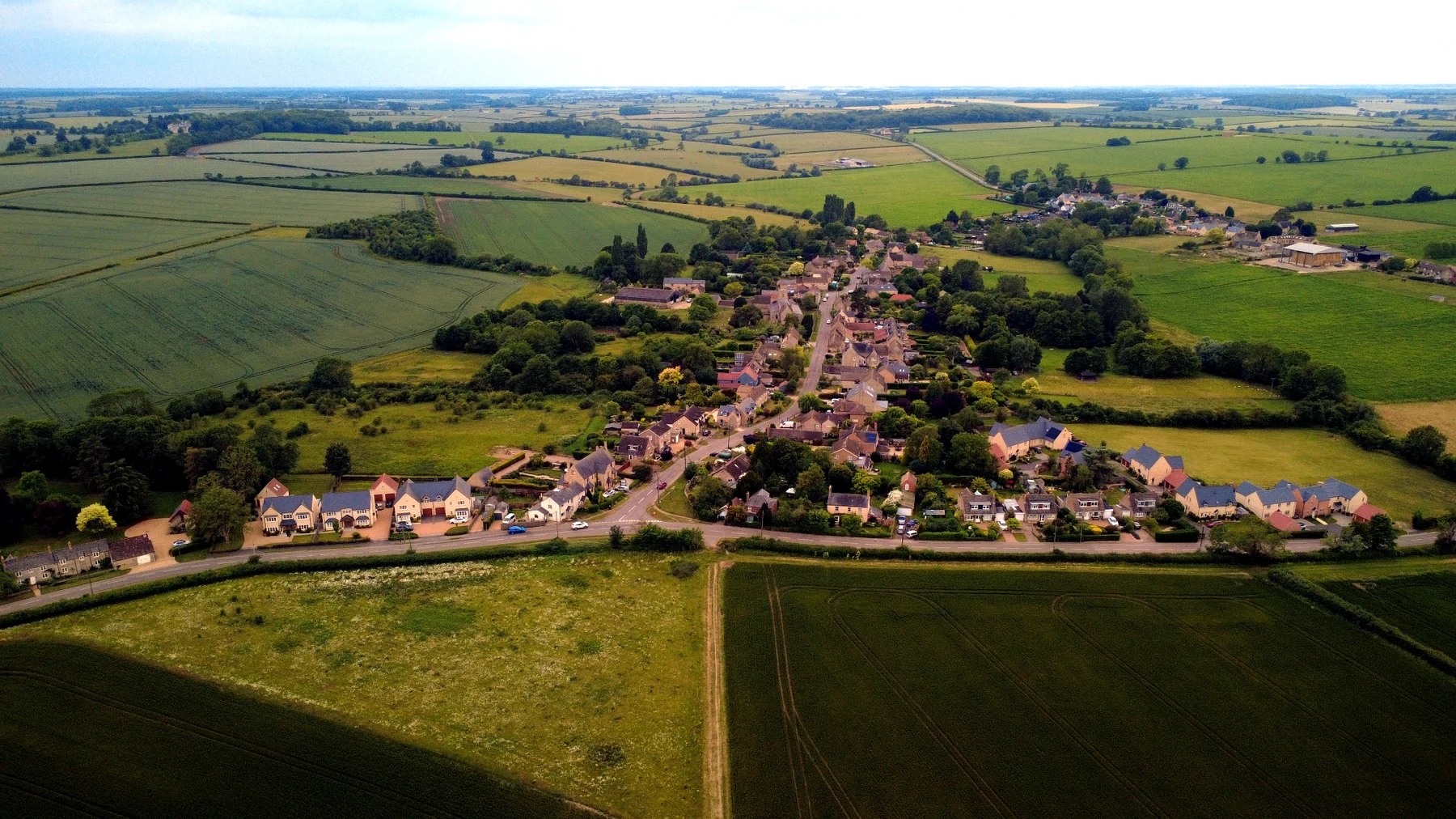 Aerial view of a local village and surrounding fields near Oundle